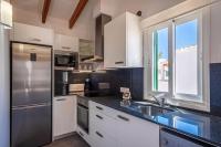 Kuchyň nebo kuchyňský kout v ubytování Villa Sol del Sur 15