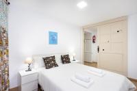 Postel nebo postele na pokoji v ubytování La Esperanza downtown 3 bd apt