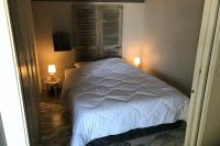 a bedroom with a white bed and two lamps at Charming Studio With Terrace And 180 Sea View in Six-Fours-les-Plages