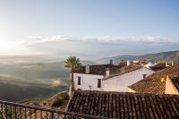 a view of a village in the mountains at Hotel Tugasa Castillo de Castellar in Castellar de la Frontera