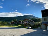 a parking lot in front of a mountain at residence clos la Chalp II in Molines-en-Queyras