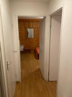an open door to a room with a bedroom at residence clos la Chalp II in Molines-en-Queyras