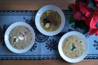 three bowls of soup on a table with flowers at Willa Aniołówka in Kościelisko
