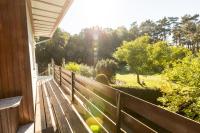 a wooden porch with a view of a park at Ferienhaus Annerose in Wendisch Rietz