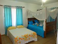 Postel nebo postele na pokoji v ubytování El Malecon B&B Hotel