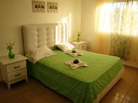 Postel nebo postele na pokoji v ubytování El Malecon B&B Hotel