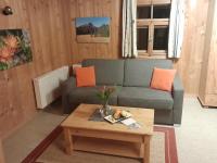 a living room with a couch and a coffee table at Haus Silke in Silbertal