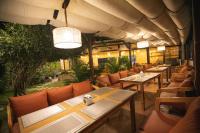 a row of tables and chairs in a restaurant at Lavie Residence and Spa in Kathmandu