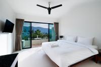 Ein Bett oder Betten in einem Zimmer der Unterkunft Hill Myna Holiday Park & Cafe