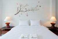 Ein Bett oder Betten in einem Zimmer der Unterkunft Hill Myna Holiday Park & Cafe