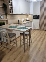 Kuchyňa alebo kuchynka v ubytovaní Apartament Słoneczny -Ściegiennego (garaż, centrum)