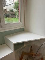 a white desk sitting next to a window at Studio calme &amp; lumineux, vue sur le jardin, WIFI in Paris