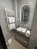 a bathroom with a sink and a mirror at Studio calme &amp; lumineux, vue sur le jardin, WIFI in Paris