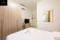 a white room with a bed and a tv at Spacious NUM1 house in Swieqi - Sleeps 18 w&#47;WIFI by 360 Estates in Is-Swieqi