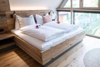 A bed or beds in a room at Kellerstöckl Heuberger