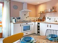 Kuchnia lub aneks kuchenny w obiekcie Le Chat Perché - Appartements 3 étoiles spacieux et chaleureux à Allemond