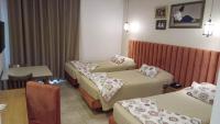 Postel nebo postele na pokoji v ubytování Larimar Hôtel Sfax
