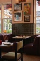 a restaurant with couches and tables in a room at The Hoxton, Downtown LA in Los Angeles