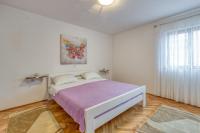 Posteľ alebo postele v izbe v ubytovaní Apartment Ana Coki