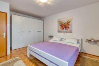 Posteľ alebo postele v izbe v ubytovaní Apartment Ana Coki