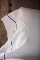 a white dress with a cross on the back of it at Hotel Tugasa Convento San Francisco in Vejer de la Frontera