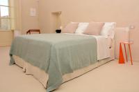 A bed or beds in a room at Casina Fontana Bed & Breakfast