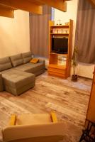 Televízia a/alebo spoločenská miestnosť v ubytovaní Western apartman