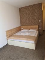 Postel nebo postele na pokoji v ubytování Hotel Mida