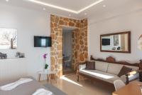 Televízia a/alebo spoločenská miestnosť v ubytovaní AnnaView Apartments & Suites