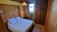 Posteľ alebo postele v izbe v ubytovaní Chalet l'Acinos