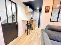 a small kitchen and living room in a tiny house at Le Loft ~ à 4 min de la gare, Fibre + Parking privé in Poitiers