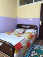Llit o llits en una habitació de Gite La belle vue Timichi