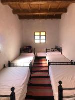 Llit o llits en una habitació de Gite La belle vue Timichi