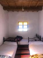 Llit o llits en una habitació de Gite La belle vue Timichi