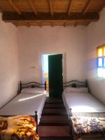 Llit o llits en una habitació de Gite La belle vue Timichi