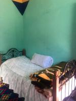 Llit o llits en una habitació de Gite La belle vue Timichi