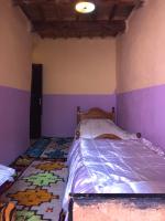 Llit o llits en una habitació de Gite La belle vue Timichi
