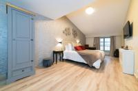 Łóżko lub łóżka w pokoju w obiekcie Les coursives appartements
