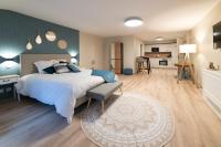 Łóżko lub łóżka w pokoju w obiekcie Les coursives appartements