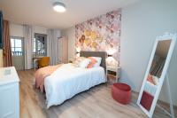Łóżko lub łóżka w pokoju w obiekcie Les coursives appartements