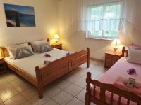 Posteľ alebo postele v izbe v ubytovaní Apartments Dodik