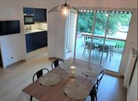 a kitchen and dining room with a table and chairs at Hossegor city in Soorts-Hossegor