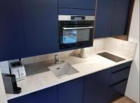 a kitchen counter with a sink and a microwave at Hossegor city in Soorts-Hossegor