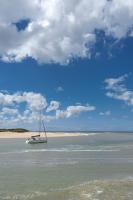 a boat in the water on a beach at 2 pièces Port Cabourg - 2 à 4 personnes - 34 m2 - Balcon - Vue Port - Nouveau sur Booking ! in Dives-sur-Mer