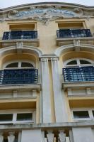 a building with blue balconies on the side of it at 2 pièces Port Cabourg - 2 à 4 personnes - 34 m2 - Balcon - Vue Port - Nouveau sur Booking ! in Dives-sur-Mer