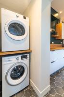 a white washer and dryer in a kitchen at L&#39;Orée du Faubourg - VENDOME CENTRE in Vendôme