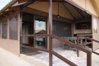 a view of a house with glass windows at Manong Game Lodge in Gaborone