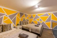 Posteľ alebo postele v izbe v ubytovaní Deluxe Residence By Bella