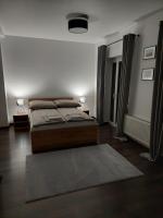 Postel nebo postele na pokoji v ubytování Komandorska Apartments