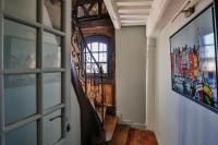 a hallway with a wooden door and a window at La Demeure du Clocher 4 - On the Port and Place St Catherine - 8 P in Honfleur
